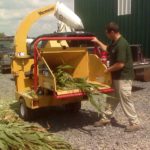 An image of a person moisture testing corn silage by chopping a sample and using a Koster.